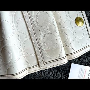 Coach bifold white leather wallet.